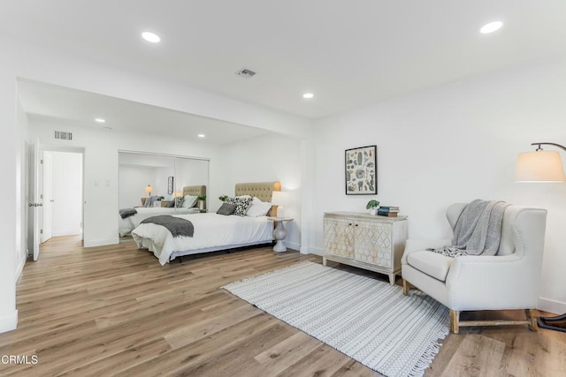 bedroom featuring a closet and light hardwood / wood-style flooring