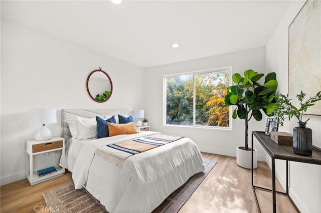 bedroom with light hardwood / wood-style flooring