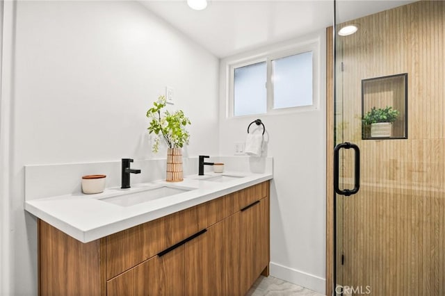 bathroom with vanity and an enclosed shower