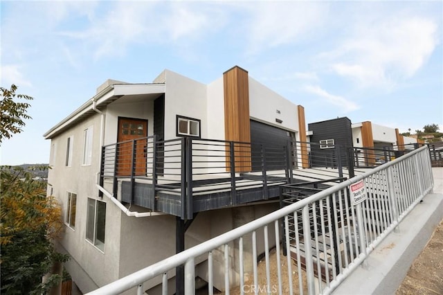 view of home's exterior with a balcony