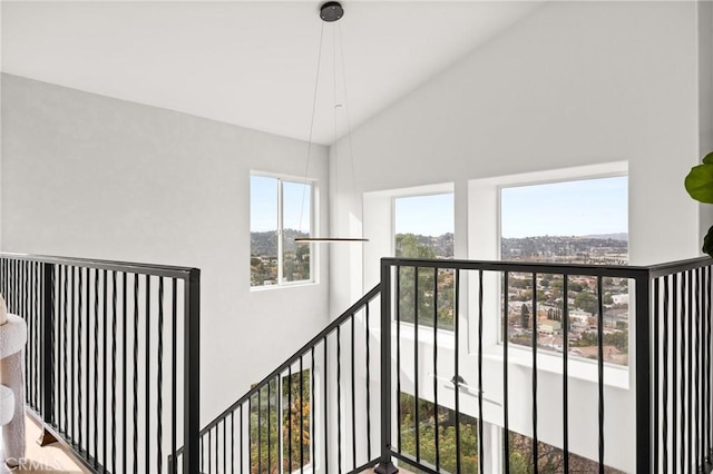 stairway featuring a high ceiling