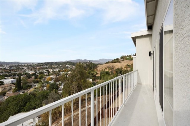 balcony featuring a mountain view