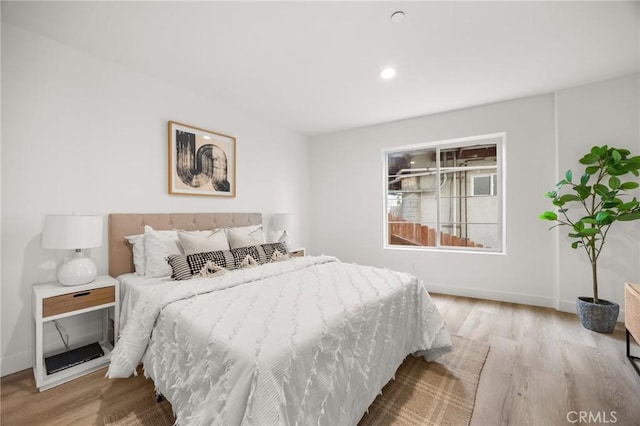 bedroom with light wood-type flooring