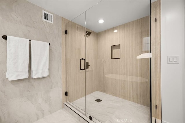 bathroom with an enclosed shower