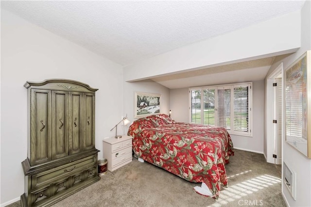 carpeted bedroom featuring a textured ceiling