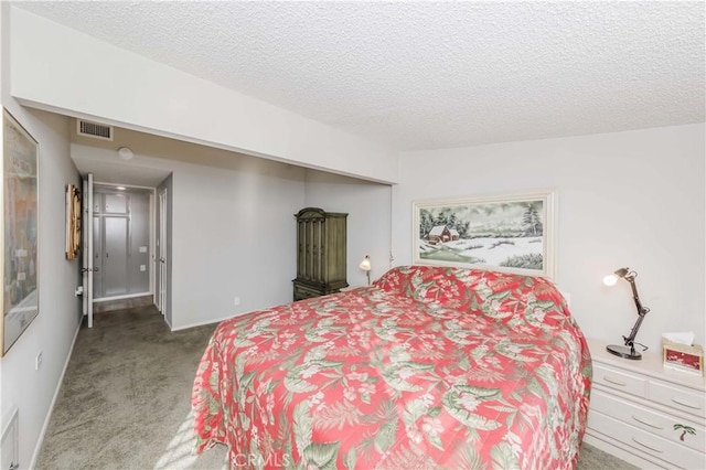 carpeted bedroom with a textured ceiling