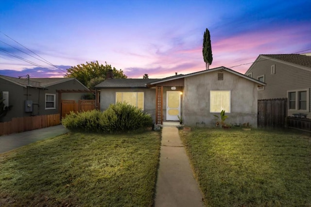 ranch-style house with a yard