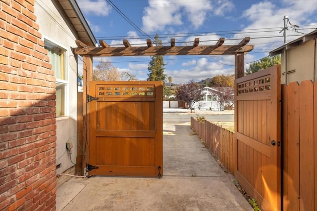 view of gate with a pergola