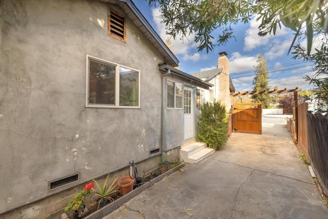 view of property exterior featuring a patio