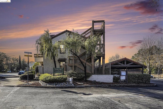 view of outdoor building at dusk