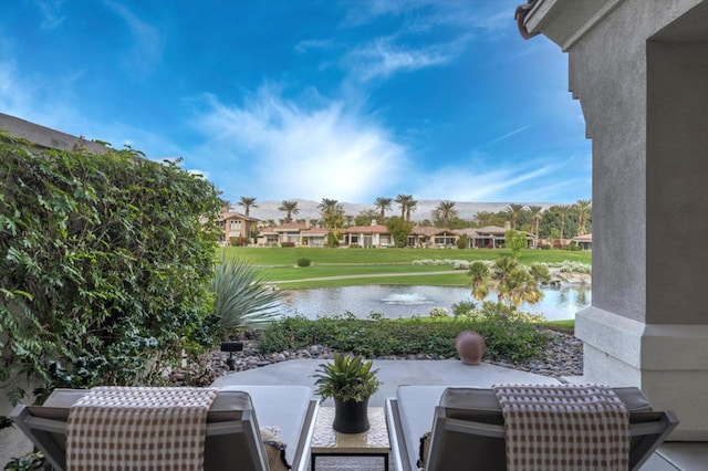 view of patio with a water view