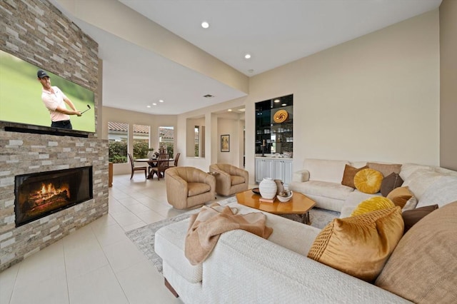 tiled living room featuring a fireplace