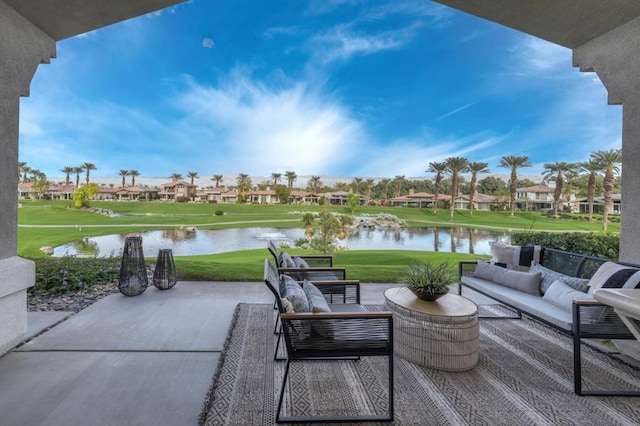 view of patio with an outdoor living space and a water view