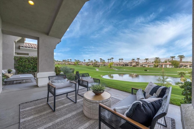 view of patio with outdoor lounge area and a water view