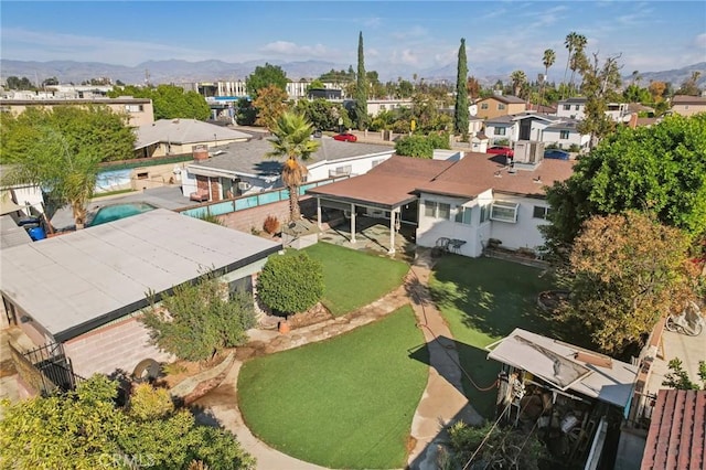 birds eye view of property with a mountain view