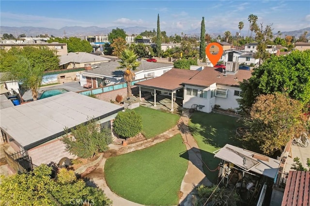 birds eye view of property with a mountain view