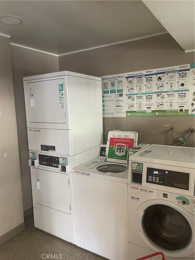 laundry room with washing machine and dryer and stacked washer and clothes dryer