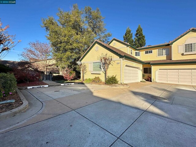 view of side of home with a garage