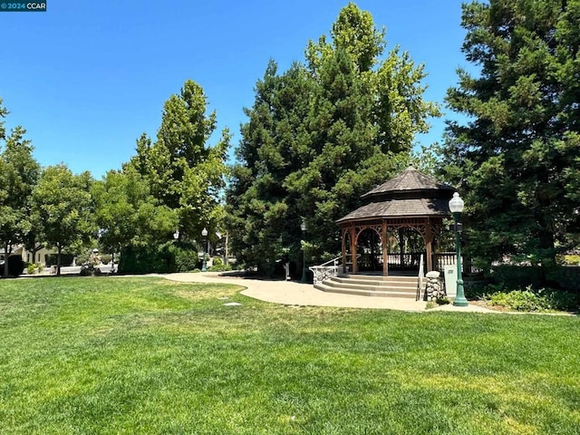 view of property's community featuring a gazebo and a lawn