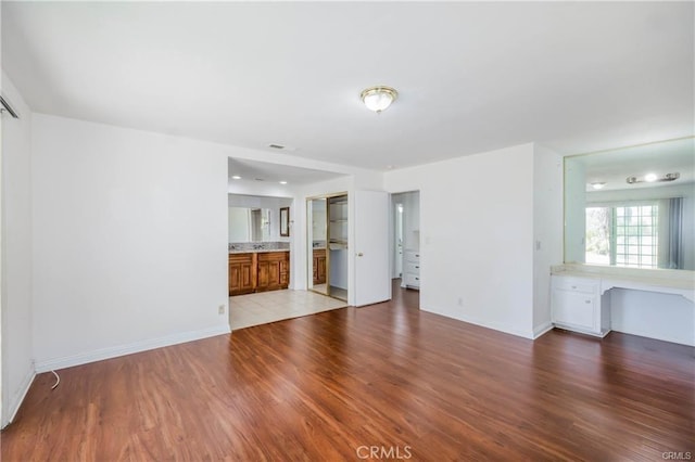 unfurnished living room with light hardwood / wood-style floors