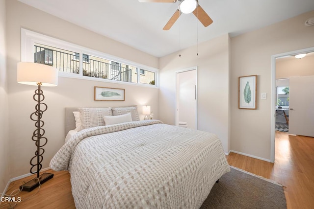 bedroom featuring light hardwood / wood-style flooring and ceiling fan