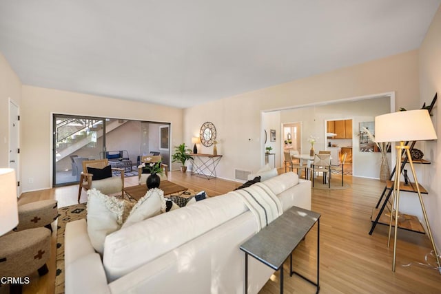 living room with light hardwood / wood-style floors