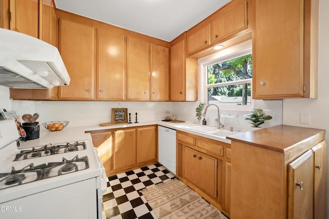 kitchen featuring white appliances and sink