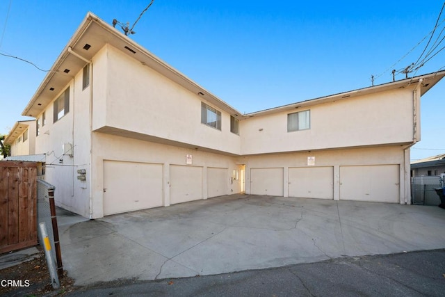 back of house with a garage