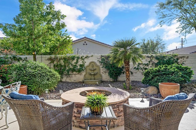 view of patio with an outdoor fire pit