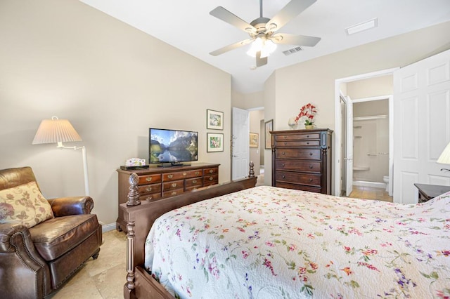 bedroom with vaulted ceiling, ceiling fan, and ensuite bathroom