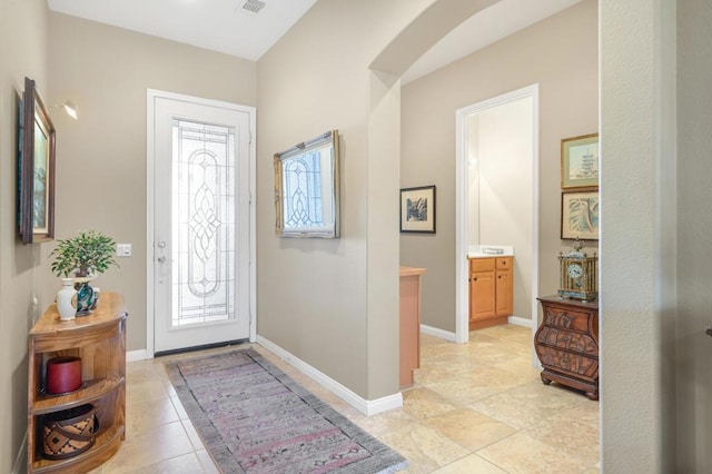 foyer entrance featuring light tile patterned floors