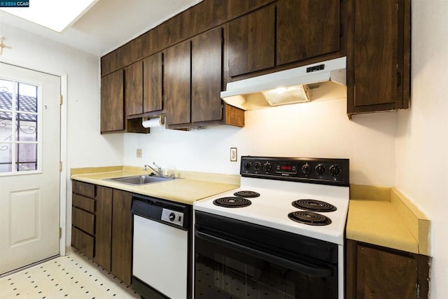 kitchen featuring dark brown cabinets, white appliances, and sink