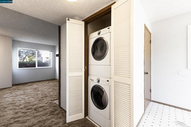 laundry room featuring carpet flooring, stacked washer / dryer, and a textured ceiling