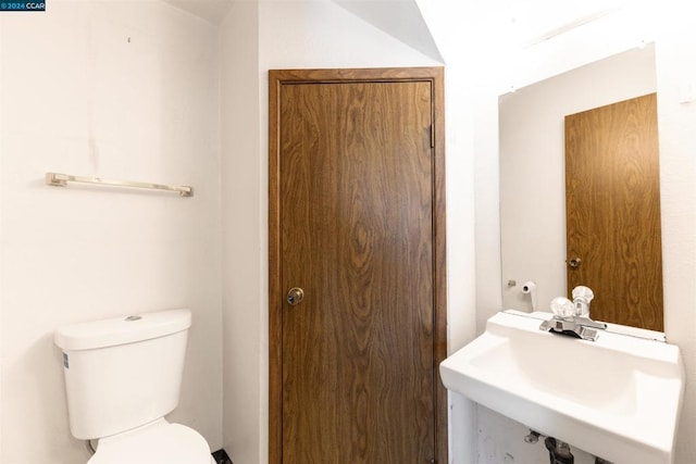 bathroom with sink and toilet