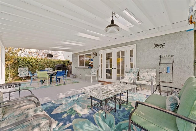 view of patio / terrace featuring ceiling fan, french doors, and an outdoor hangout area