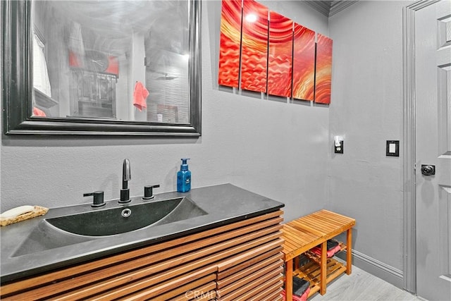 2052 Thomas Pl, West Covina, CA 91792 - bathroom featuring baseboards, vanity, and ornamental molding