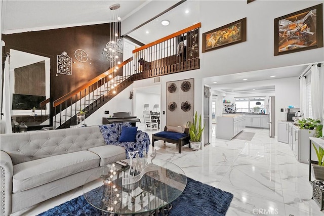 living room featuring beamed ceiling, a towering ceiling, and an inviting chandelier