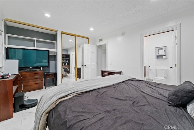 2052 Thomas Pl, West Covina, CA 91792 - bedroom with marble finish flooring, a textured ceiling, connected bathroom, recessed lighting, and a closet