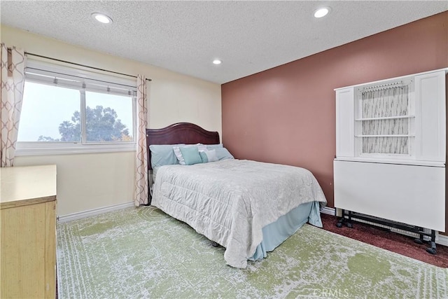 carpeted bedroom with a textured ceiling