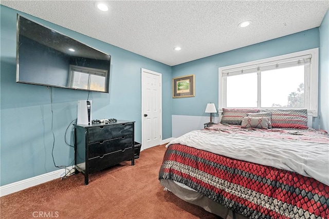 carpeted bedroom with a textured ceiling