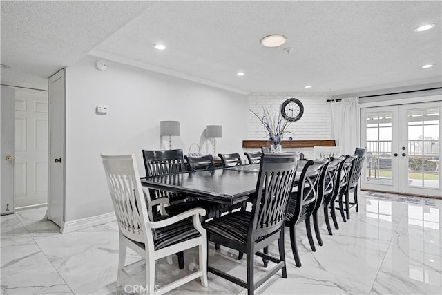 dining space featuring french doors and a textured ceiling