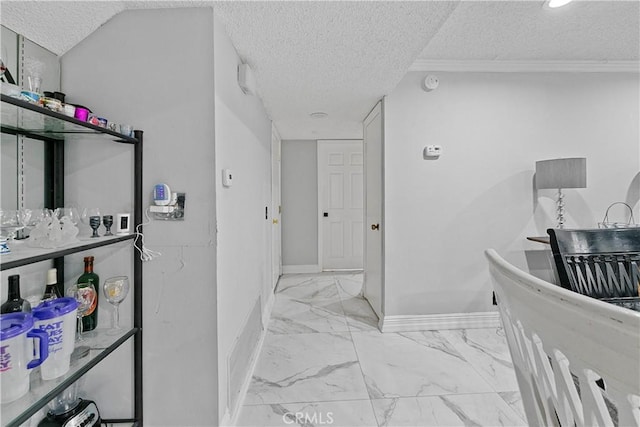 2052 Thomas Pl, West Covina, CA 91792 - hallway featuring a textured ceiling, marble look tiles, baseboards, and ornamental molding