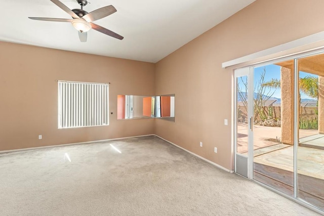 carpeted empty room featuring ceiling fan