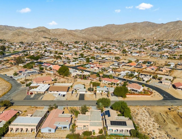 birds eye view of property featuring a mountain view