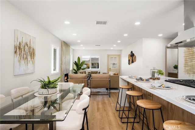 dining space featuring light hardwood / wood-style floors