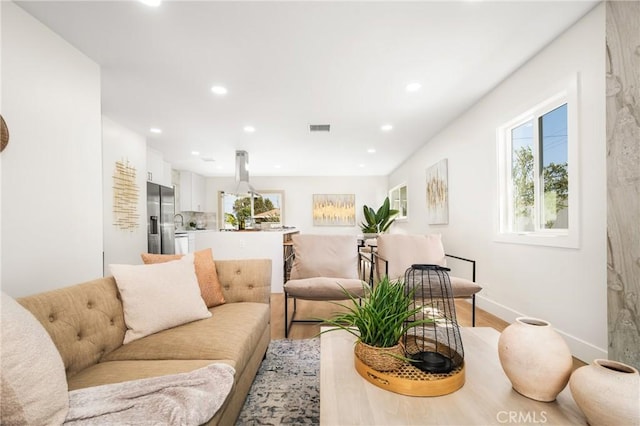 living room with light hardwood / wood-style flooring