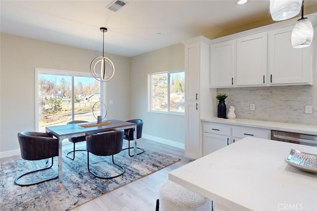 dining room with light hardwood / wood-style flooring