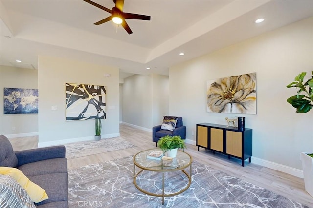 sitting room featuring ceiling fan and hardwood / wood-style flooring