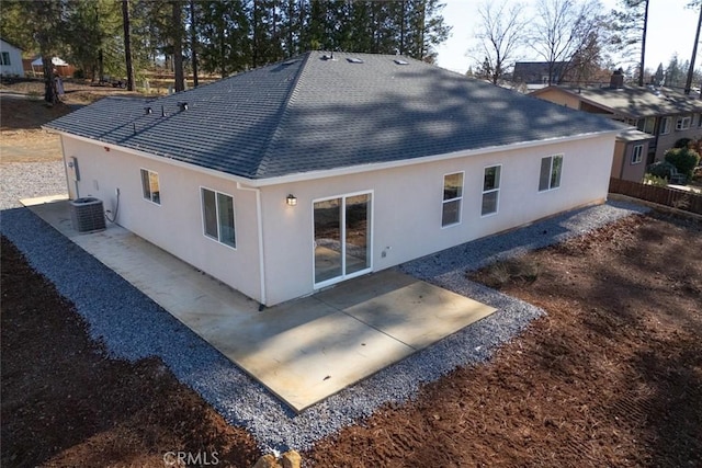 back of house with cooling unit and a patio