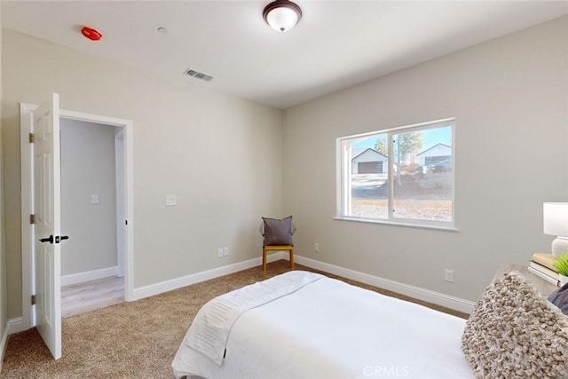 bedroom with light carpet